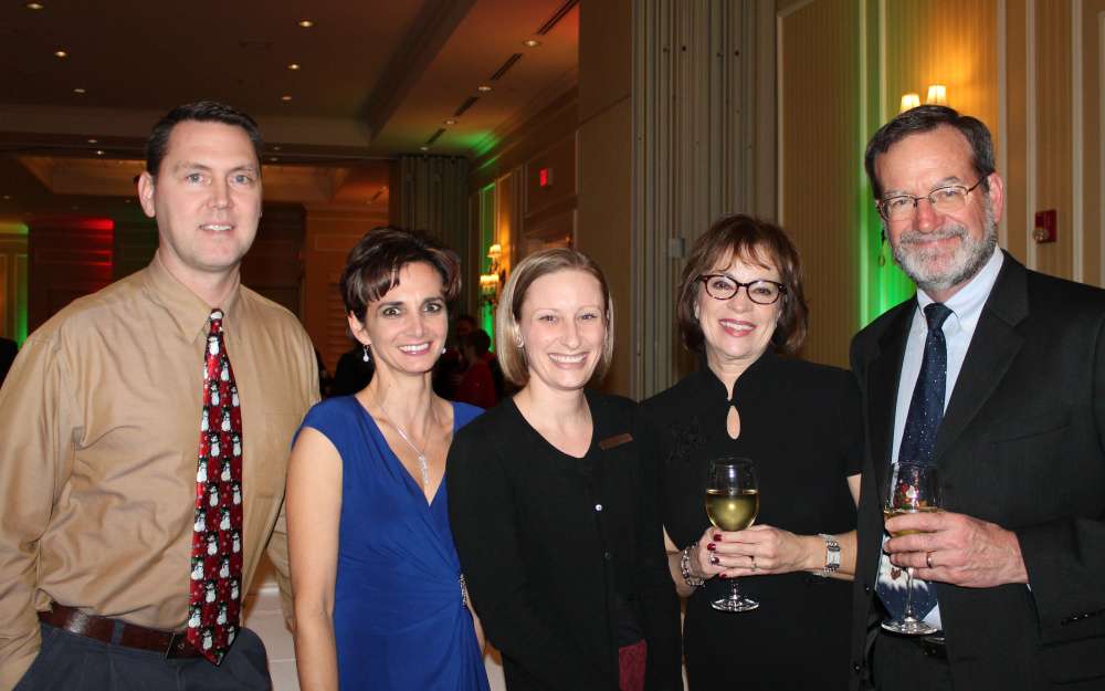 James Beardsley, left, attorney with Lowry & Associates, joins colleagues Karen Hanna and Michael Vaughn, with his wife, Diane Vaughn; and Brooke Kreider, center, event manager at Marriott Sable Oaks.