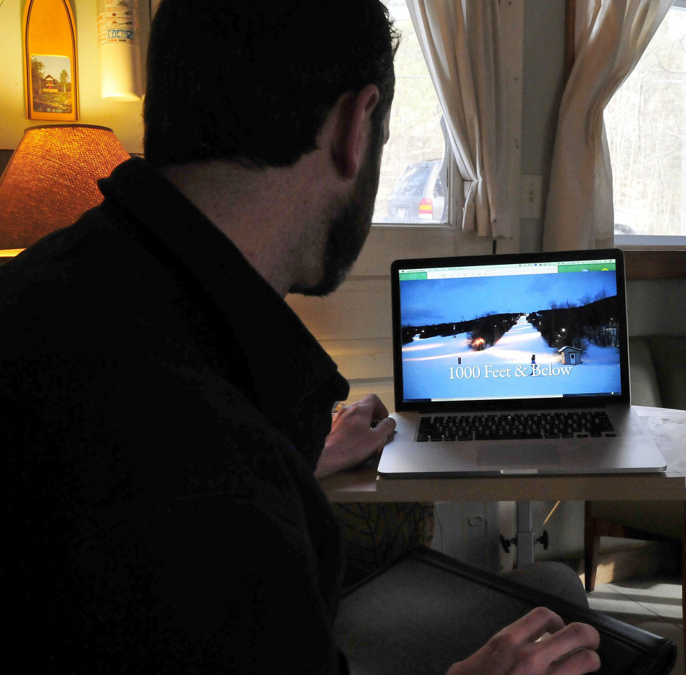 Joel Osgood works at his home in New Portland on Monday. His documentary on small ski areas in Maine, years in the making, premieres Wednesday at Sugarloaf.