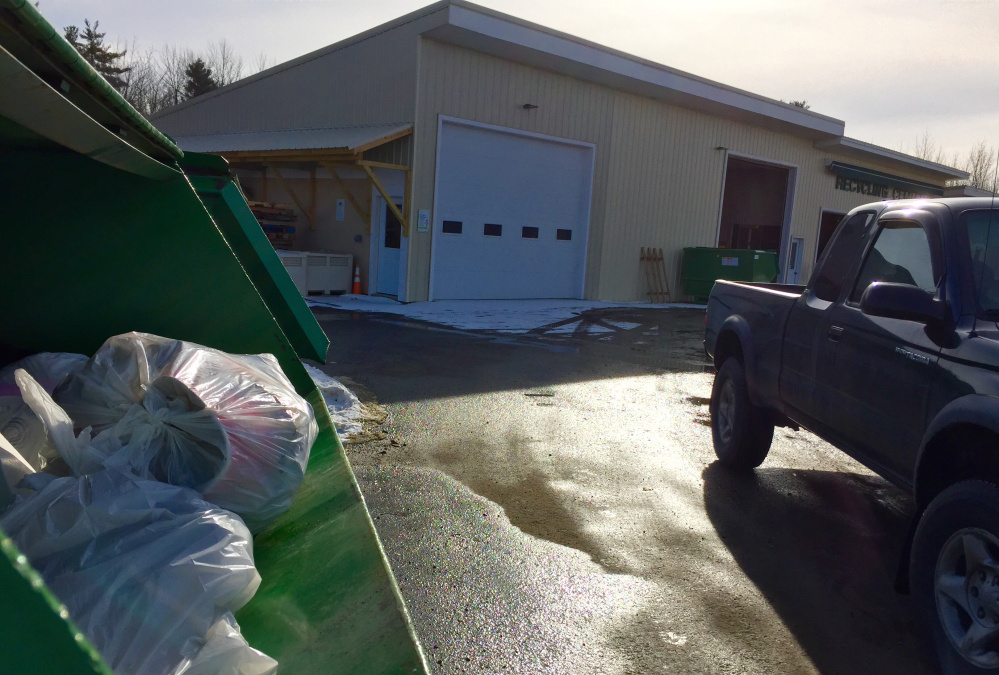 Trash containers are filled Saturday afternoon at China’s town transfer station off Alder Park Road. The town is enacting a trial pay-as-you-throw program starting July 1 that will require residents to buy special trash bags.