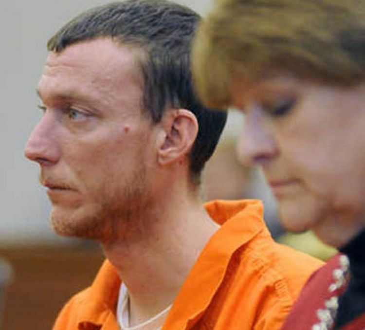 Mark Halle of Waterville listens during his bail hearing in February at the Capital Judicial Center in Augusta, with with his attorney, Pamela Ames.