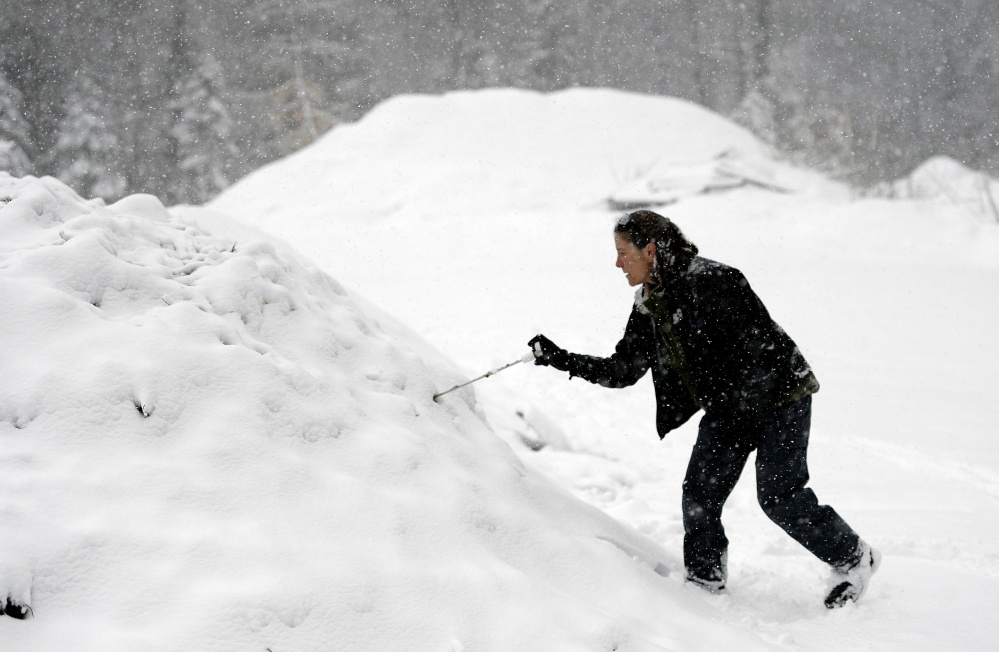 AUBURN, ME - FEBRUARY 5: Michelle Melaragno of Compassionate Composting checks the temperature of a windrow at Whistle Ridge Farm in Auburn Friday, February 5, 2016. (Photo by Shawn Patrick Ouellette/Staff Photographer)