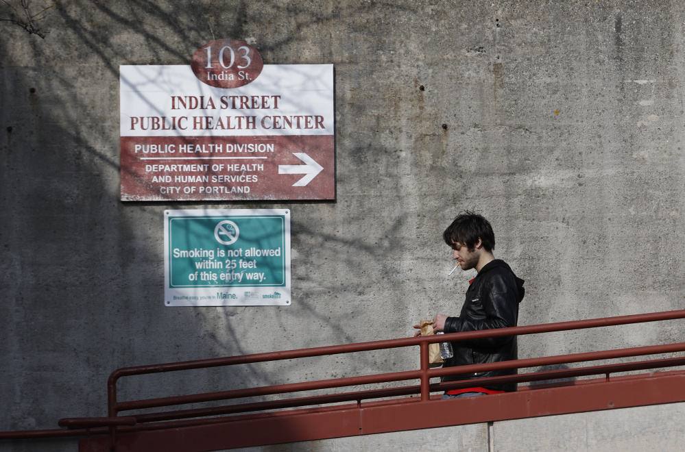 Joshua Squires leaves the India Street Public Health Center in Portland on Friday. Squires was disappointed to learn that the city is proposing closing the facility and said he plans to go to the public hearing to speak.