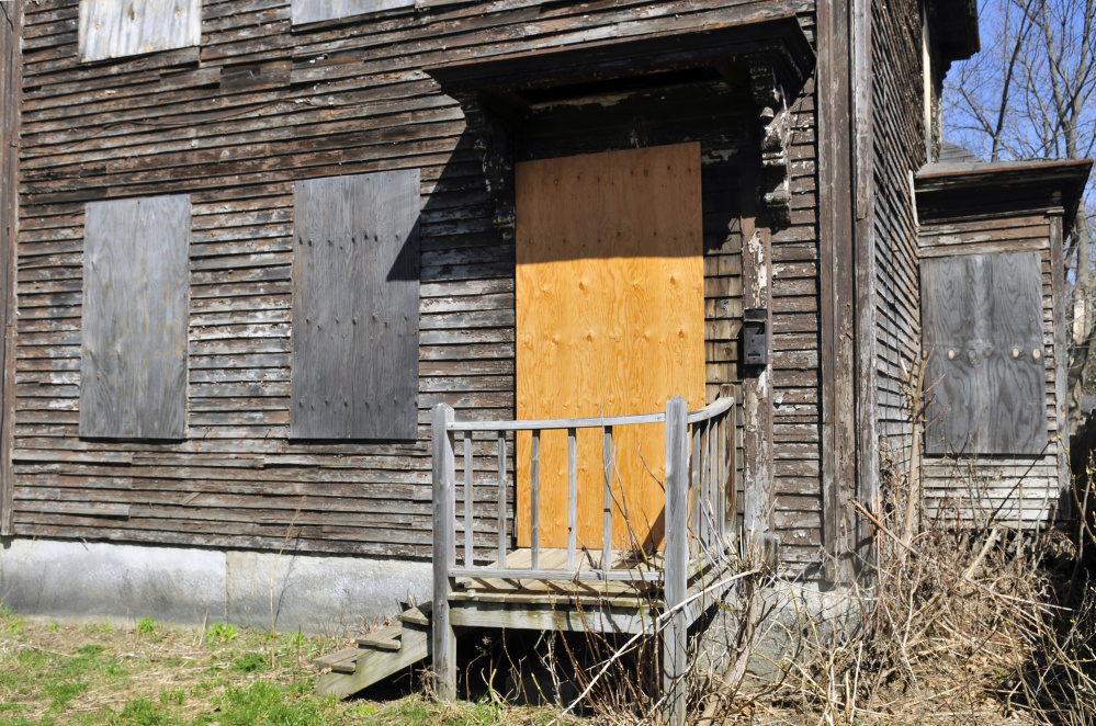 This Tuesday photo shows the boarded up windows at 5 Patterson St. in Augusta.