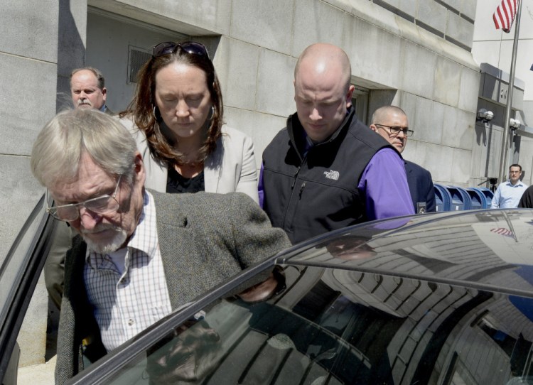 Merrill "Mike" Kimball is led out of the Cumberland County Courthouse after being found guilty of murder last year. He is appealing the verdict.