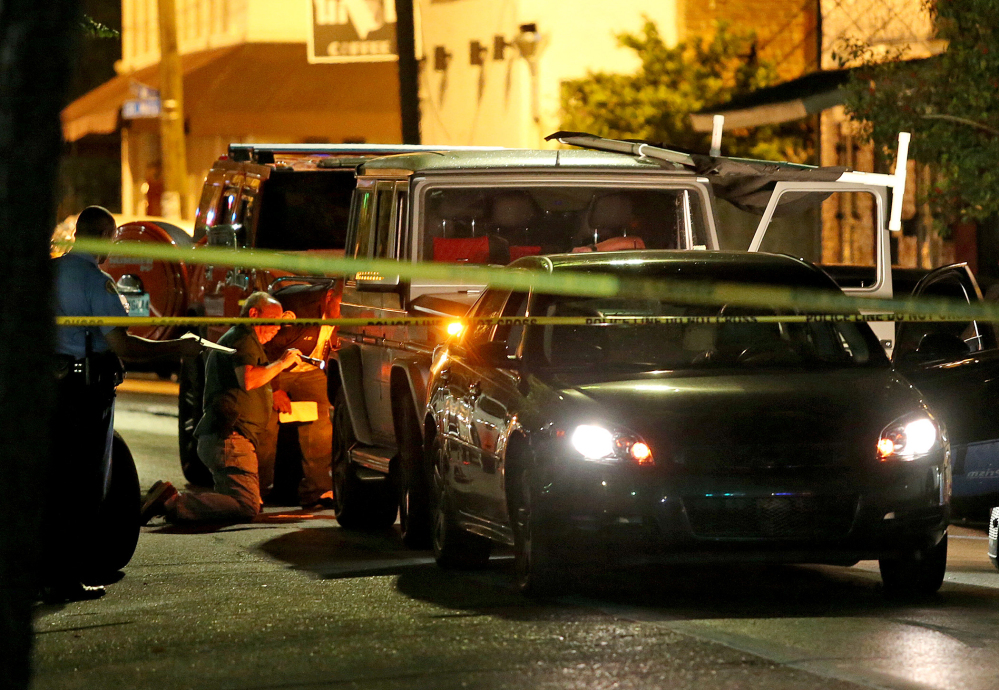 The Associated Press/ Michael DeMocker/NOLA.com The Times-Picayune New Orleans Police investigate the scene of a shooting Saturday, in New Orleans.