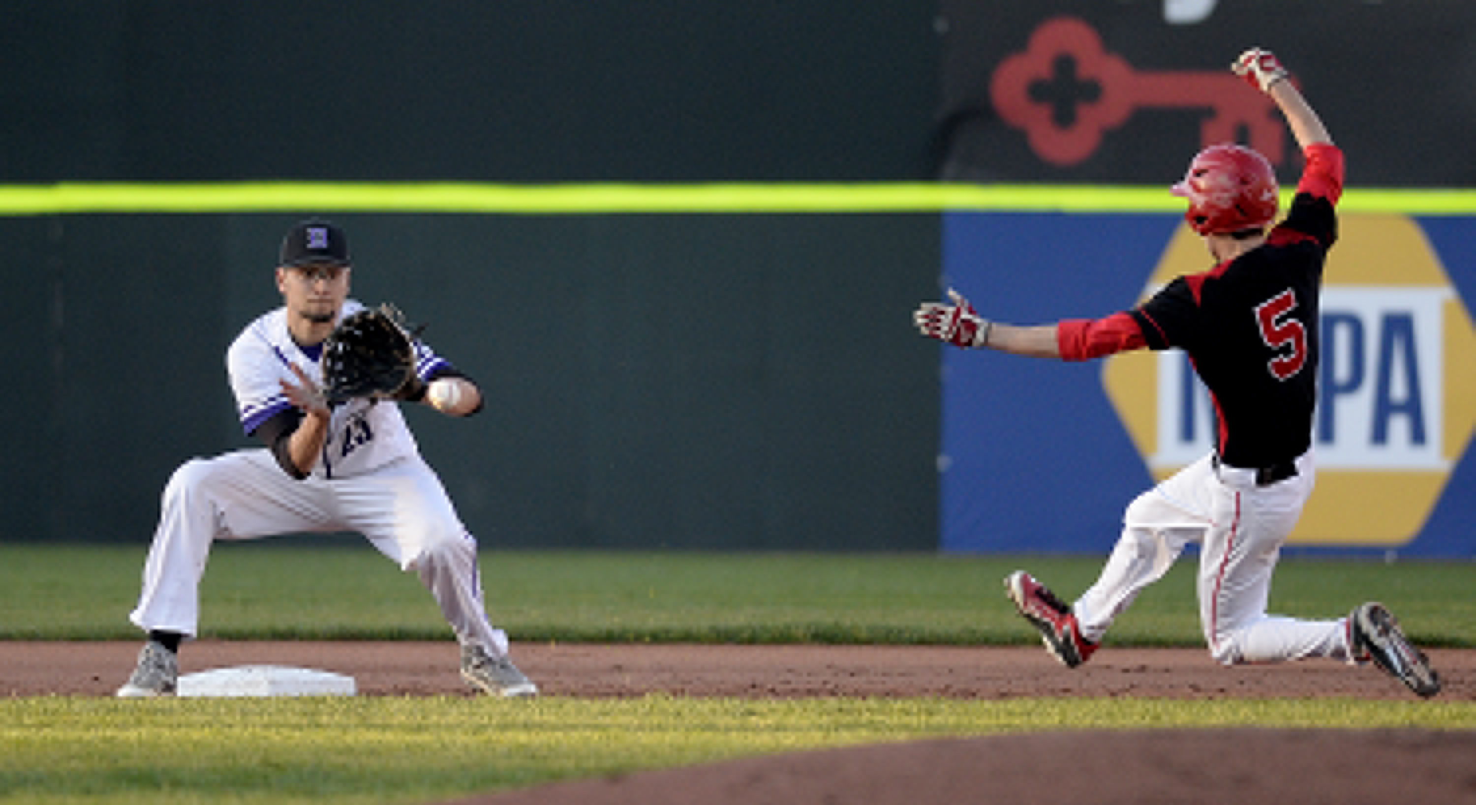 Deering's Pat Viola waits for the ball as Scarborough's Nick Lorello begins his slide into second with a stolen base Tuesday. Shawn Patrick Ouellette/Staff Photographer