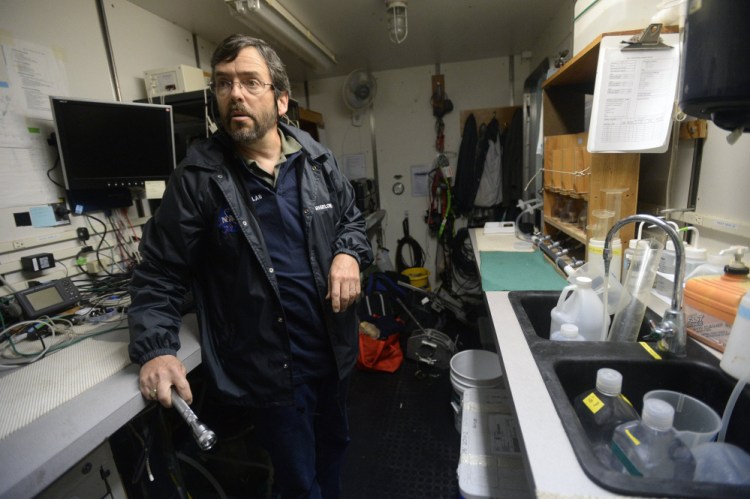 William Balch, senior research scientist at Bigelow Labs, prepares in his truck for a 2014 trip on the Gulf of Maine to study phytoplankton distribution. Balch used Henry Bryant Bigelow's detailed color measurements to show the water looks different now than it did a century ago.