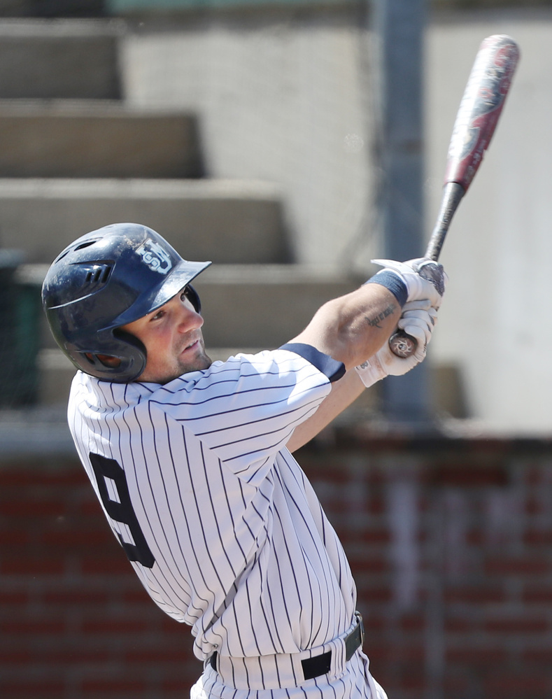 Sam Stauble of USM watches the flight of the ball after taking a swing against Eastern Connecticut State. Stauble had three hits and drove in three runs in the doubleheader as the Huskies improved to 29-11.