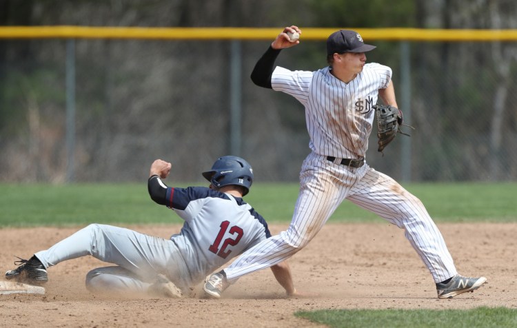 Jake Dexter of the University of Southern Maine throws to first for a double play Friday after Tim Budd of Eastern Connecticut State was out at second. USM swept the doubleheader and has a seven-game winning streak. The league tournament opens Wednesday.