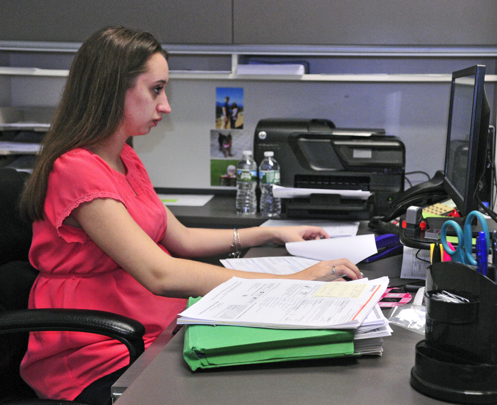 Amy Lapierre works at Scott's Recreation on Thursday in Manchester. Lapierre will be graduating from both Maranacook Community High School and Thomas College this spring.