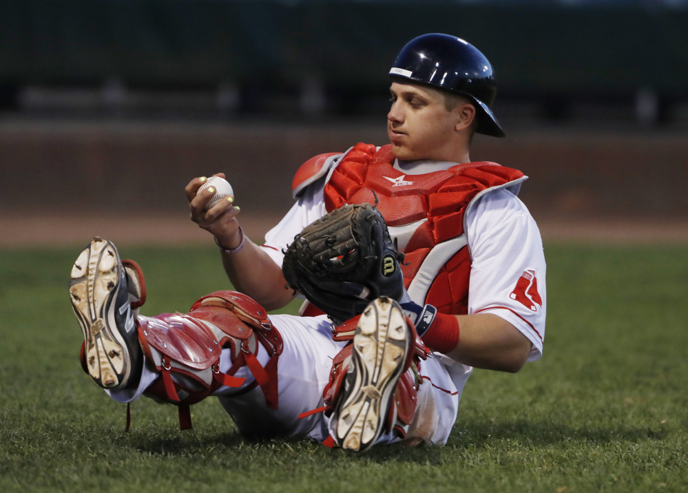 Portland catcher Jake Romanski catches a foul ball in the ninth inning Tuesday. Joel Page/Staff Photographer