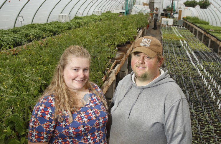 Jonathan Tibbetts with his wife, Kelly, at Tibbetts Farm in Lyman.