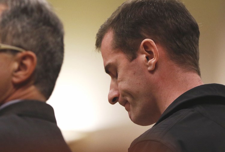 Gerald White, a former art teacher at Portland High School, listens to the state's evidence against him before pleading guilty to possession of sexually explicit material of a minor under the age of 12. Ben McCanna / Staff Photographer