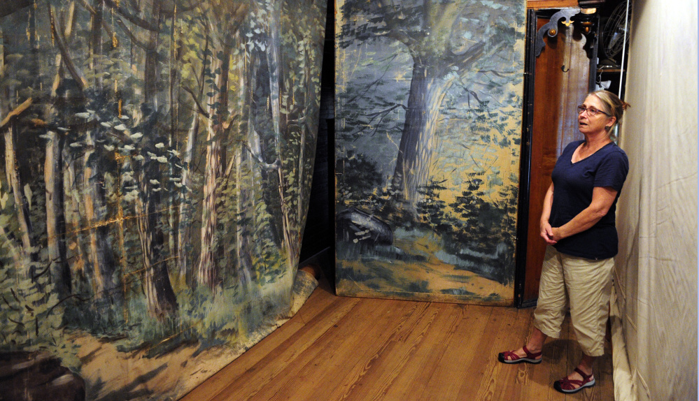 Maggie Chadwick gives a tour Thursday of the backstage area in the former Grange hall on second floor of Starling Hall in Fayette.