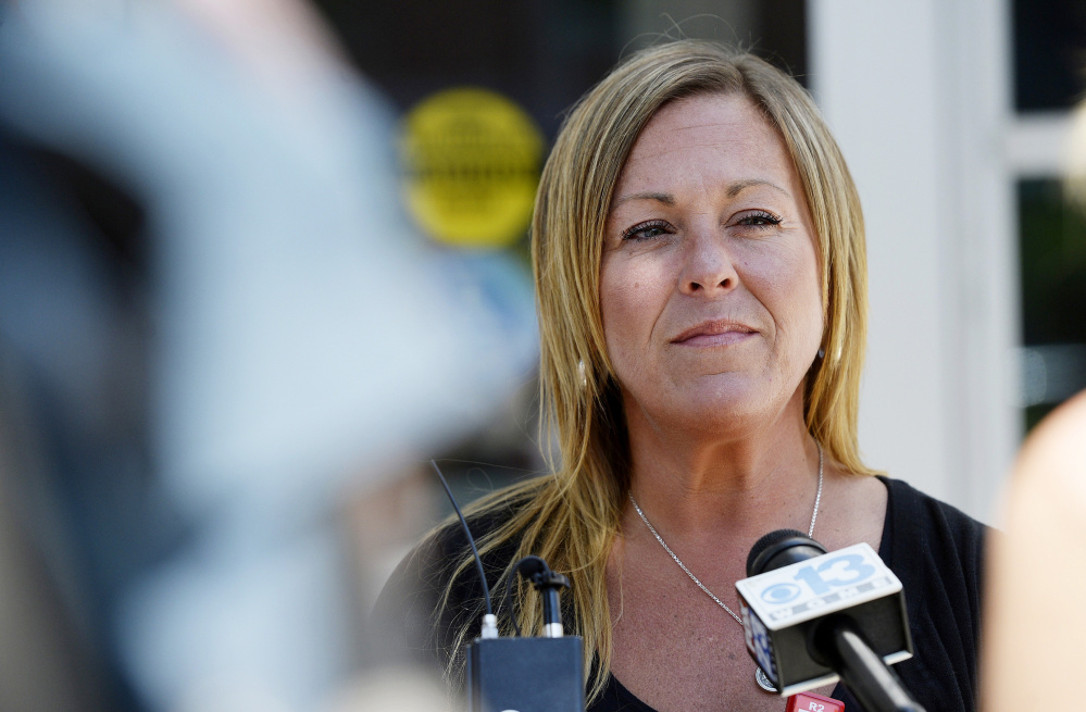 Nancy Laxson, the mother of shooting victim Treyjon Arsenault, speaks to reporters after Johnny Ouch's court appearance Thursday. The trial for Gang Deng Majok, the man accused of shooting her son, is scheduled to begin Sept. 12.