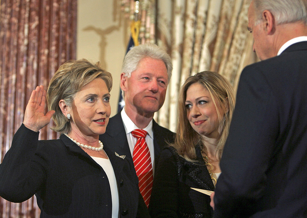 Chelsea Clinton watches as her mother is sworn in as secretary of state by  Vice President Joe Biden on Feb. 2, 2009.  Lawrence Jackson / Associated Press