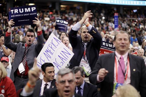 Delegates cheer during the second day of the Republican National Convention Tuesday. Gov. Paul LePage made a forceful case that as a Donald Trump supporter and governor he should be part of the delegation. But he twice told audiences in July he would stay at home and focus on his work in Maine. Matt Rourke/Associated Press