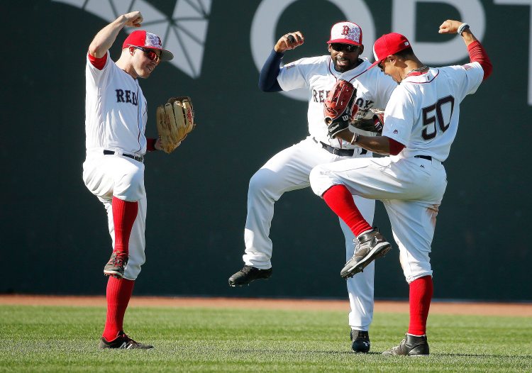 Boston's Jackie Bradley Jr., middle, and Mookie Betts, right, will make their first All-Star Game starts next week.
Associated Press/Michael Dwyer