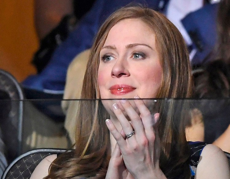 Chelsea Clinton watches the proceedings on Day 2 of the Democratic National Convention in Philadelphia Tuesday. She has spent most of her life in the public eye, moving to the White House at the age of 12 after her father was elected in 1992 and heading to Stanford University with a security detail in tow. Mark J. Terrill / Associated Press