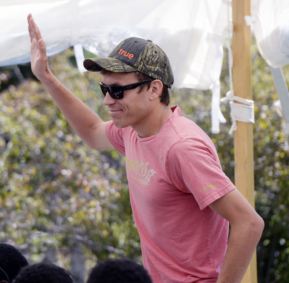 Ben True acknowledges the cheers Friday as he's introduced during the Beach to Beacon news conference in Cape Elizabeth. True is among the favorites in the U.S. division.