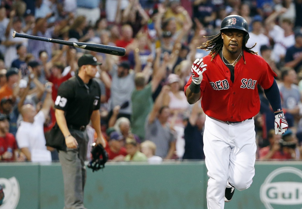 Boston's Hanley Ramirez tosses his bat after hitting a three-run home run in the first inning Friday night against the Arizona Diamondbacks in Boston.