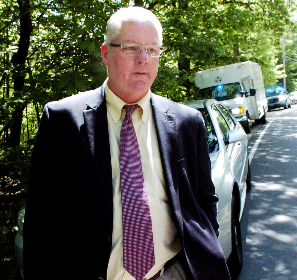 Lt. Brian McDonough, of the Maine State Police, speaks with reporters June 1 outside the property at 259 Weld Road in Wilton where Michael Reis died early that day.