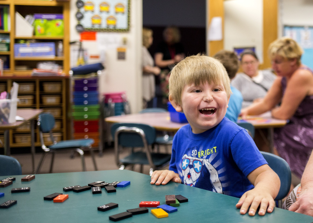 Ashton Hutchins, 5, wears a big smile in his classroom at Songo Locks School on the next-to-last day of the new Jump Start program, aimed at helping youngsters who have never been to daycare or pre-kindergarten.