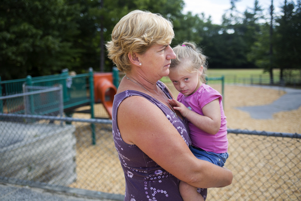 Jill Flagg holds Hannah Allen, 5, at Songo Locks School Thursday. Brianna Soukup/Staff Photographer