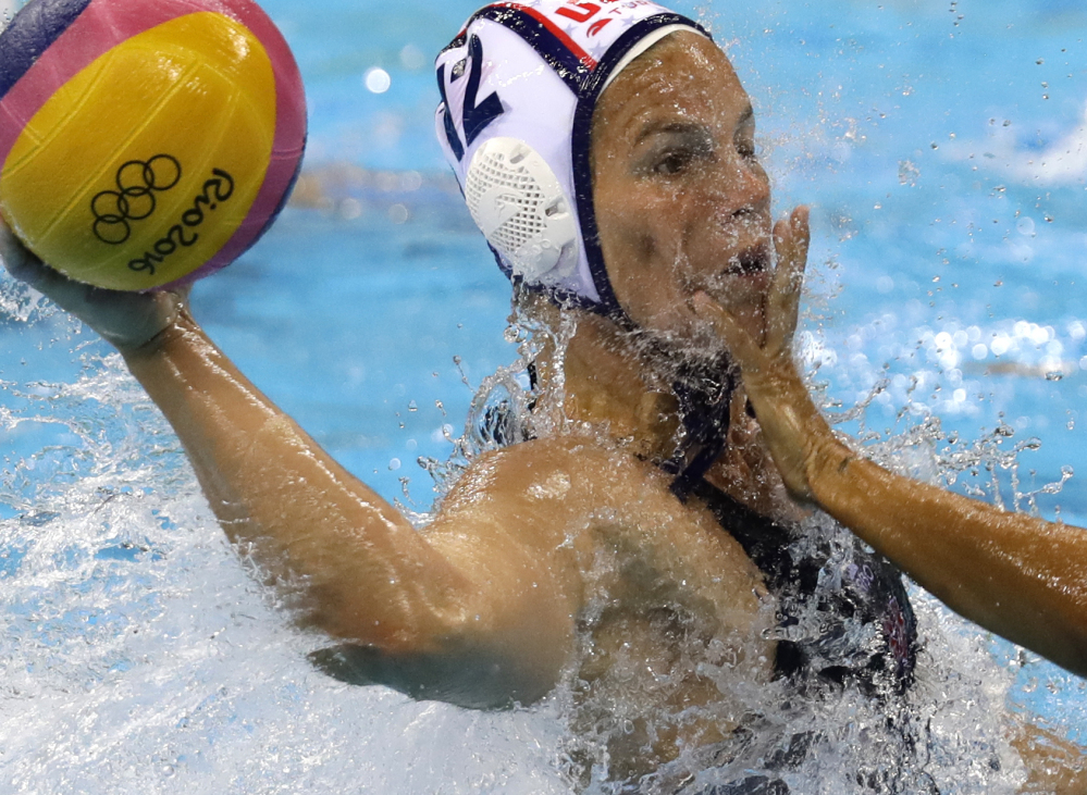 United States' Kami Craig takes a shot as Italy's Federica Radicchi defends during women's gold medal water polo match at the 2016 Summer Olympics in Rio de Janeiro, Brazil, on Friday.
Associated Press/Sergei Grits