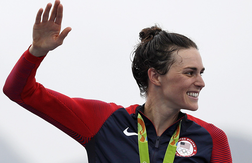 Gwen Jorgensen of the United States waves after receiving the gold medal for the women's triathlon  on Copacabana beach in Rio de Janeiro, Brazil, on Saturday.