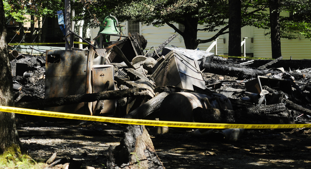 This photo taken on Tuesday shows some of the six buildings that burned Monday at Washington Advent Christian Camp in Washington.