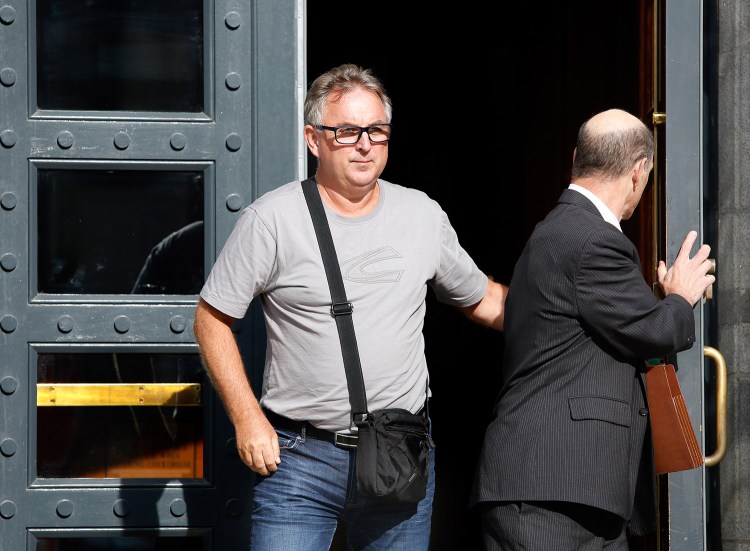 Arvid Andersen, left, the father of Espen Brungodt, a Norwegian man accused in a threat to kill Portland police officers, leaves the courthouse with federal defender David Beneman after Brungodt was arraigned on Tuesday in Portland.