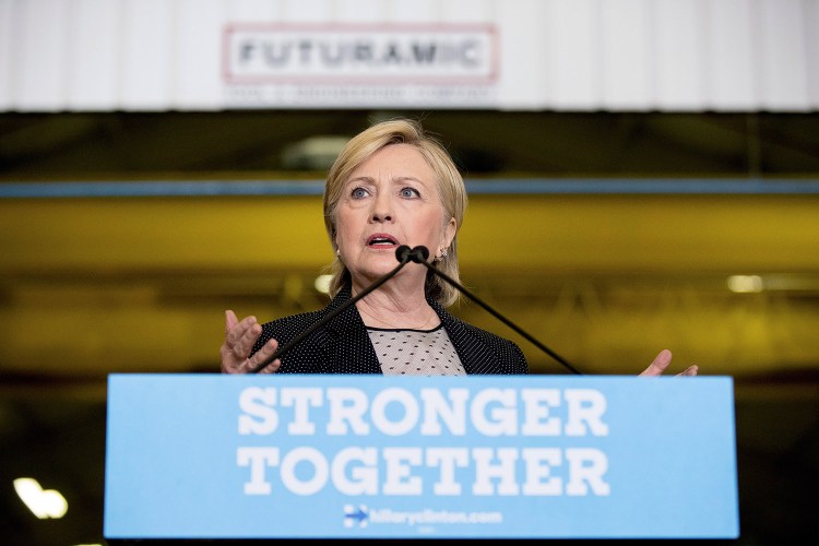 Democratic presidential candidate Hillary Clinton promotes her plan to invest in infrastructure in Warren, Mich., in August.