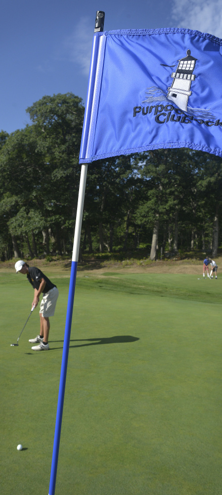 Cole Spencer, a Cape Elizabeth senior, putts on Purpoodock's ninth hole.