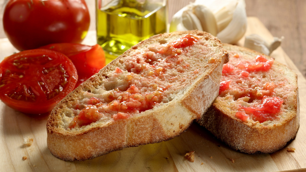 Pan de tomate is a simple way to savor the flavor.