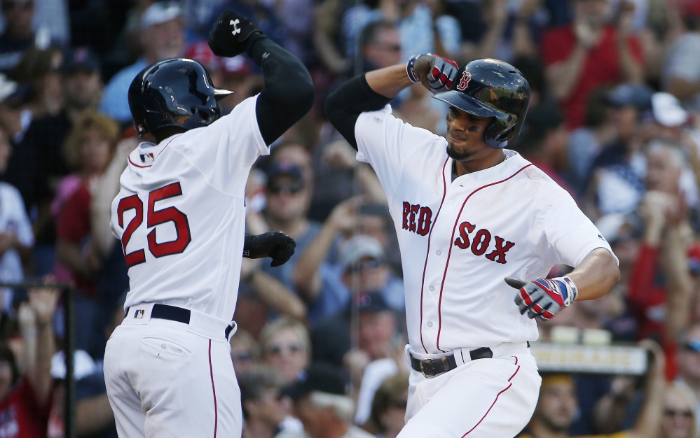 Boston's Xander Bogaerts, right, with Jackie Bradley Jr. after hitting a two-run home run in the fifth inning of the Red Sox' 6-5 win over the Yankees in Boston.