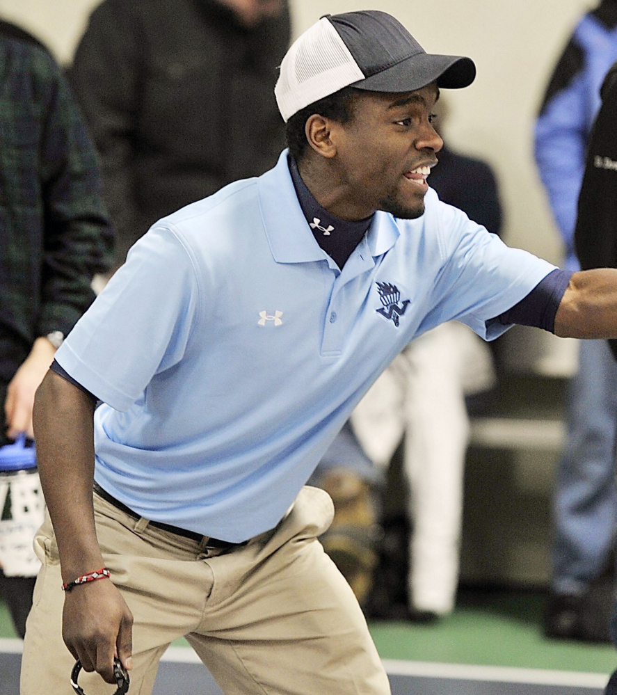 Westbrook girls' track coach Timothy Even cheers on his team during a competition in 2012. He is also the head coach of girls' cross country.