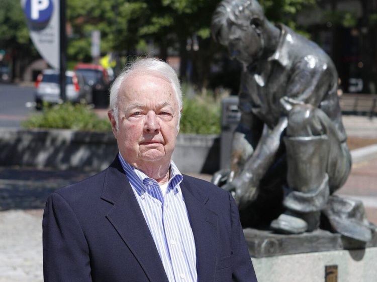 Former Portland City Manager John Menario poses for a photo in 2016, when the plaza next to the Temple Street parking garage was renamed John Menario Plaza. He died Thursday at 83.