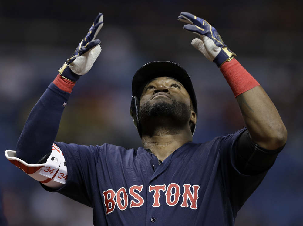 David Ortiz reacts after his two-run home run off Tampa Bay starter Chris Archer in the first inning Friday night in St. Petersburg, Fla.