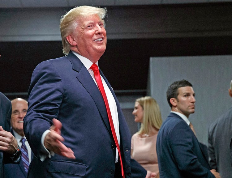 Republican presidential nominee Donald Trump speaks to supporters in an overflow room during a campaign rally recently in Greenville, N.C. <em>Evan Vucci/Associated Press</em>