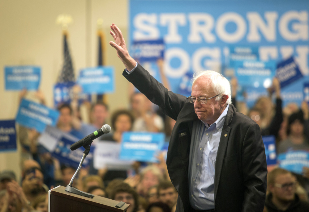 Sen. Bernie Sanders waves after speaking at the Cross Insurance Center on Friday. Sanders urged 2nd District voters to cast their ballots for Hillary Clinton.