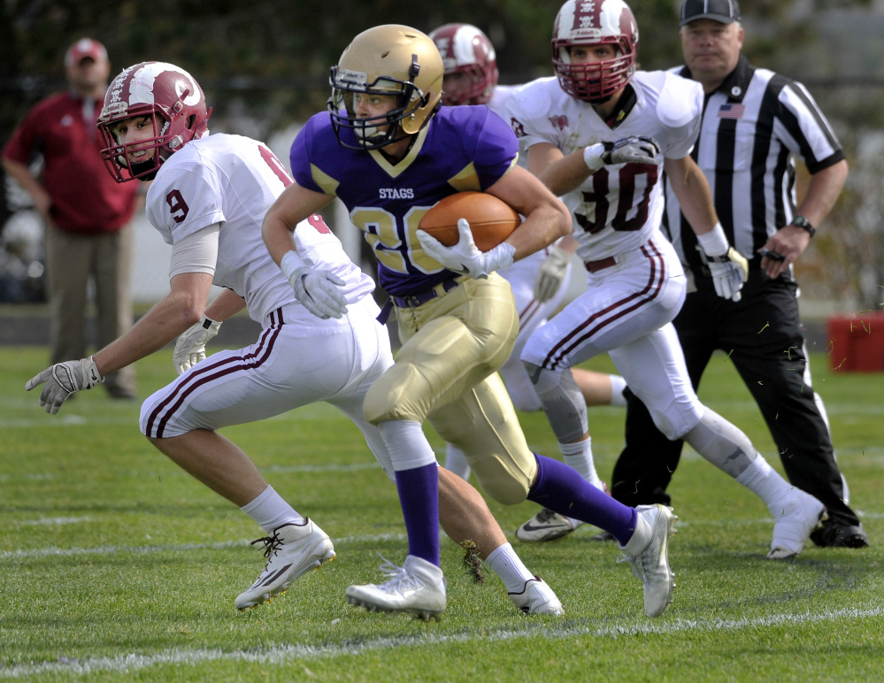 Cheverus running back Max Coffin breaks into the Bangor secondary for a big gain Saturday at Boulos Stadium. Coffin rushed for 141 yards and a touchdown in a 30-0 victory.