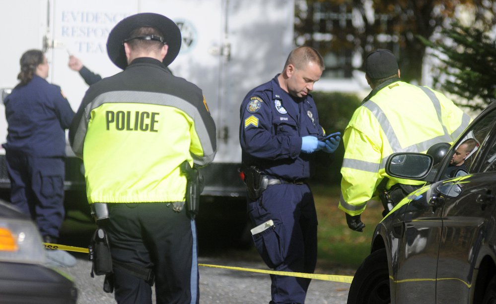 Winthrop and state police gather evidence and pets from the Winthrop home where two bodies were discovered early Monday morning. 
Any Molloy/Kennebec Journal