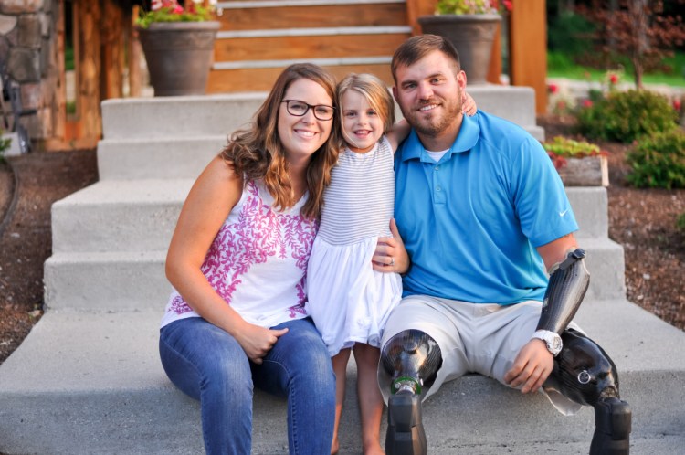 Travis Mills with his wife Kelsey and daughter Chloe.