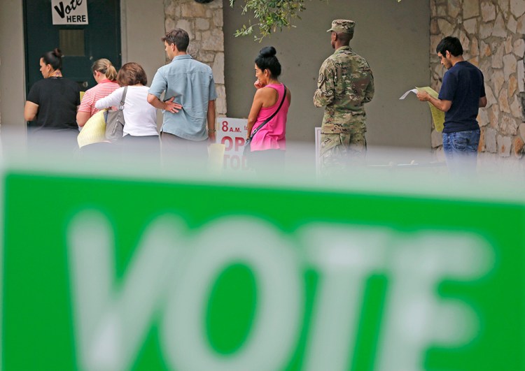 Voters wait in line to cast ballots at an early polling site in San Antonio, Texas, on Nov. 4.  Thanks to early voting, more than 50 million people may have voted before Election Day. <em>Associated Press/Eric Gay</em>