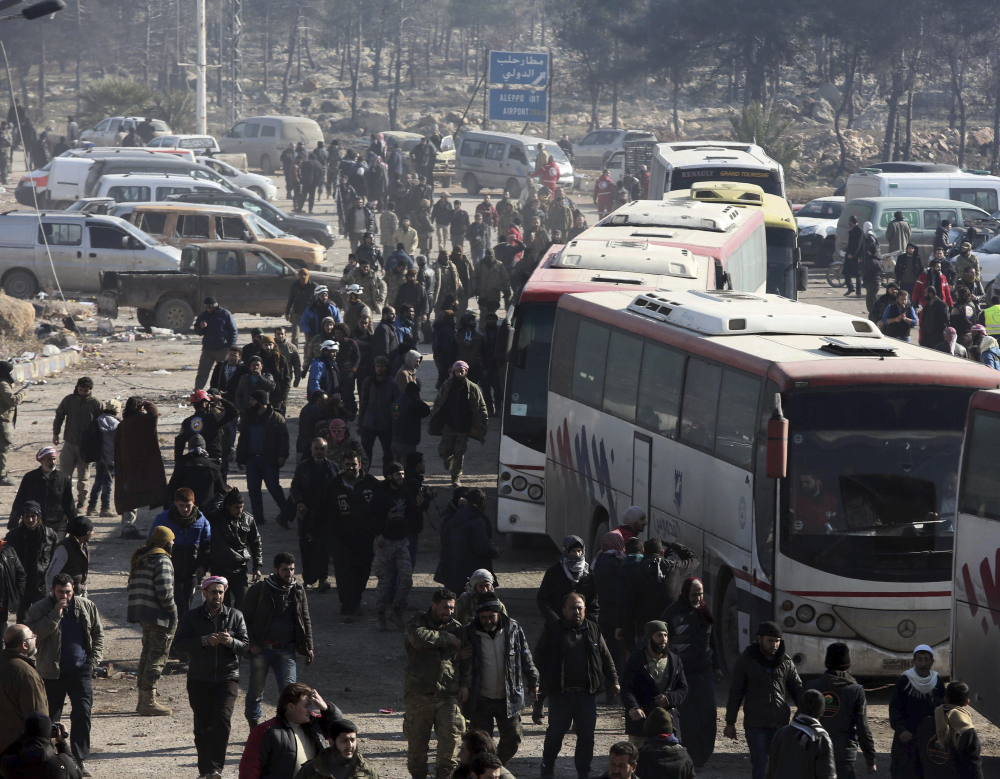 Syrians evacuated from the embattled Syrian city of Aleppo during the cease-fire arrive at a refugee camp in Rashidin, near Idlib, Syria, early Monday. The Security Council on Monday approved the deployment of U.N. monitors to the Syrian city of Aleppo as the evacuation of fighters and civilians from the last remaining opposition stronghold resumed after days of delays.