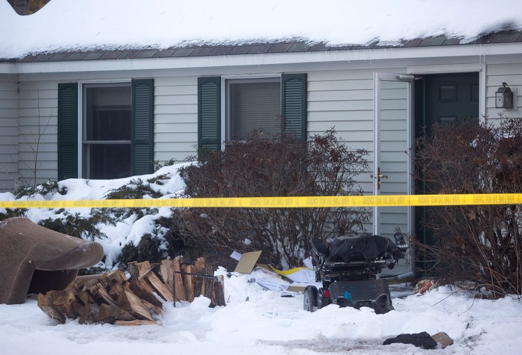 A wheelchair sits outside a home in Brunswick where a man was badly burned when the wheelchair caught fire in the living room Friday.