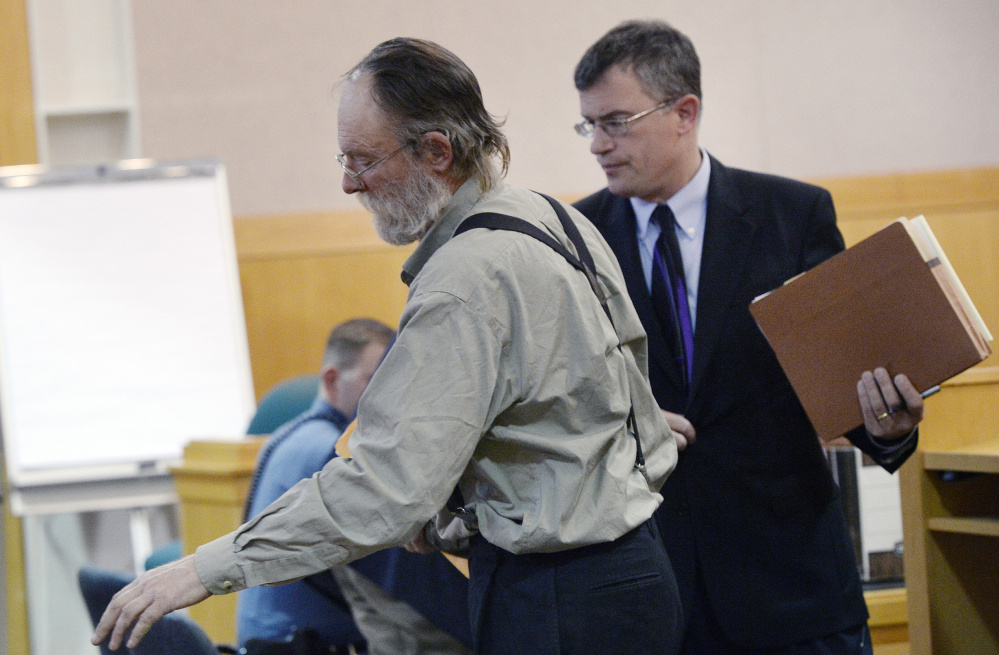 Henry Eichman leaves court with his attorney, Randall Bates, after Eichman's arraignment Tuesday at West Bath District Court. He is free on $5,000 cash bail, with conditions that, among other things, bar him from contacting anyone under the age of 16. Eichman is due back in court March 8.