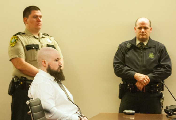 Leroy Smith III sits in court Friday during a hearing on his competence to stand trial for the 2014 killing of his father.