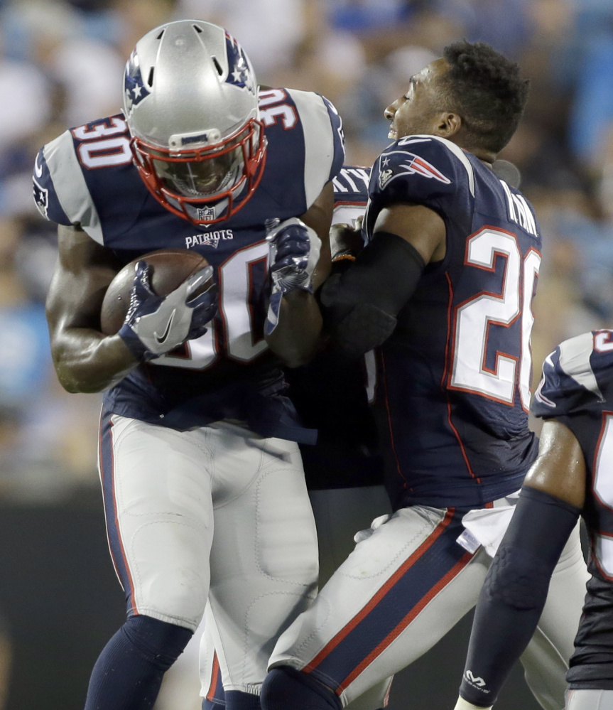 New England defensive backs Duron Harmon, left, and Logan Ryan were certainly familiar with each other before joining the Patriots, having played their college ball at Rutgers. They will be two of the four starters from the school in the Super Bowl.